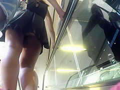 Upskirt of girl with black dress and boyfriend