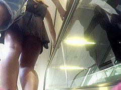Upskirt of girl with black dress and boyfriend