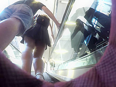 Upskirt of girl with black dress and boyfriend