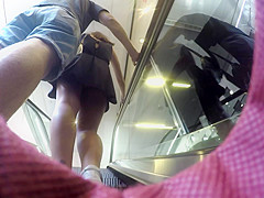 Upskirt of girl with black dress and boyfriend