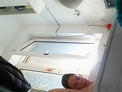 Wife spied in bathroom seated in the bathtub