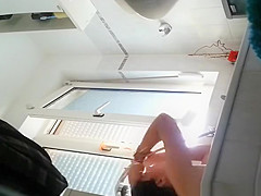 Wife spied in bathroom seated in the bathtub