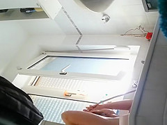 Wife spied in bathroom seated in the bathtub