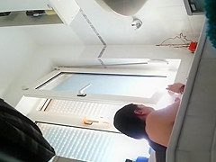 Wife spied in bathroom seated in the bathtub