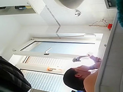 Wife spied in bathroom seated in the bathtub