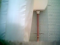 mature woman peeing in toilet