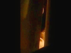 through window - mature couple masturbates each other