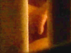 through window - mature couple masturbates each other
