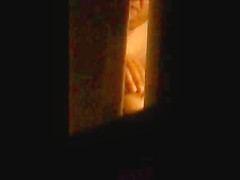 through window - mature couple masturbates each other