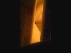 through window - mature couple masturbates each other